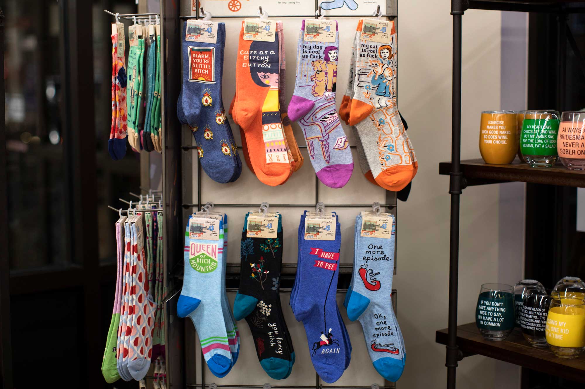 Blue Q socks on a rack