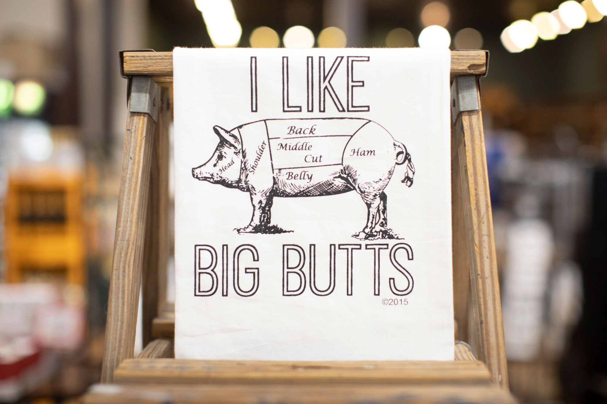photo of a kitchen towel saying I like Big Butts with illustration of a pig
