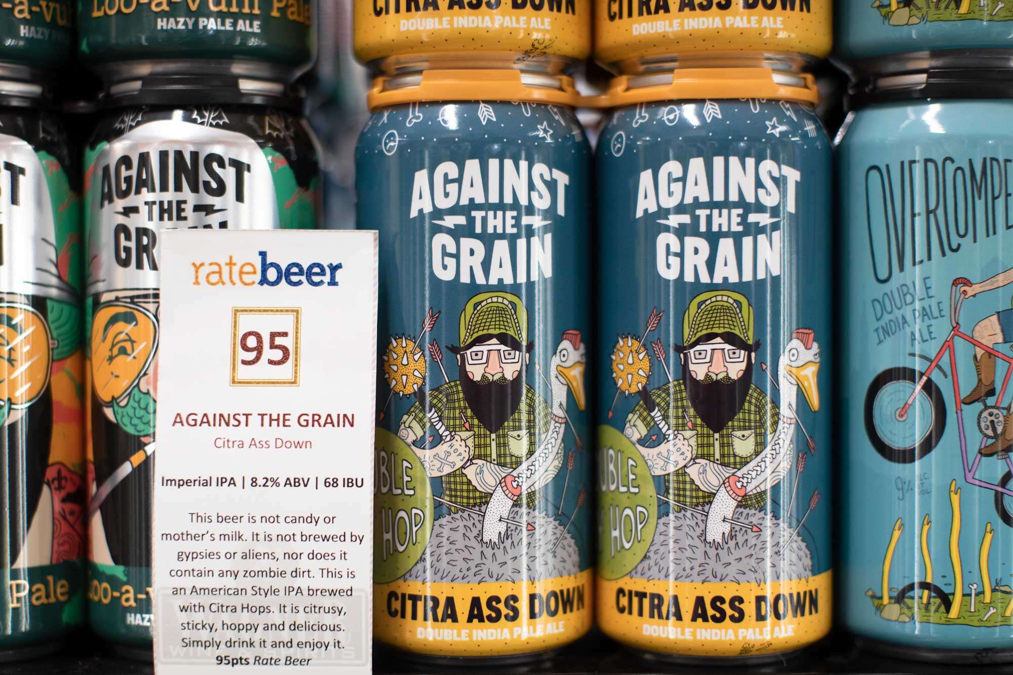 shelf talker with cans of beer